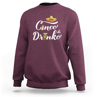 Maroon crewneck sweatshirt with white “Cinco de Drinko” text and sombrero graphic