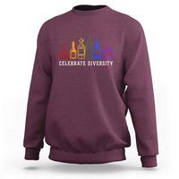 Maroon LGBTQ pride sweatshirt with “Celebrate Diversity” bottle graphic