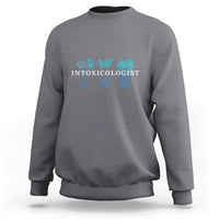 Heather gray crewneck sweatshirt with turquoise 'INTOXICOLOGIST' bar drink graphic