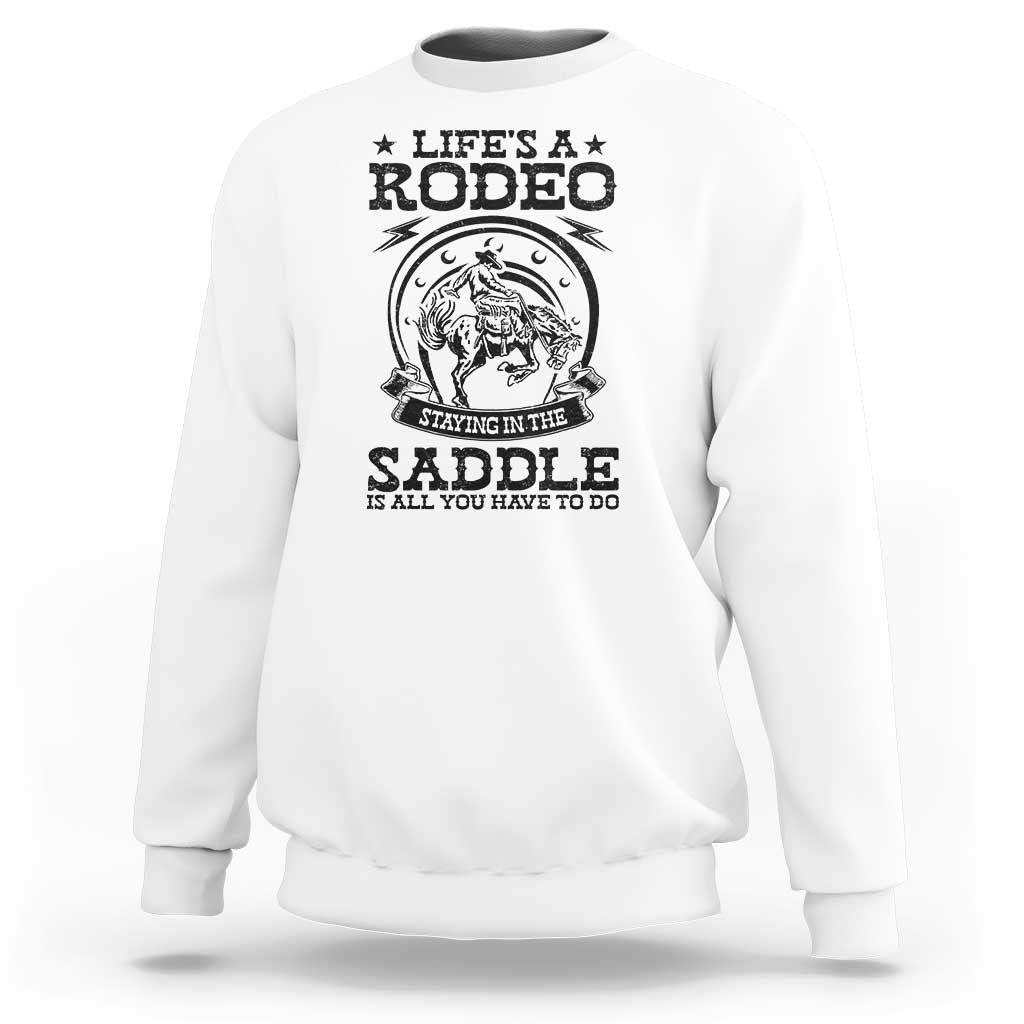 White cowboy sweatshirt with rodeo horse graphic and “Stay in the saddle” text