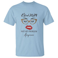 Light blue retirement T-shirt with 'Retired 2024' lips and glasses graphic, 'Not My Problem' text