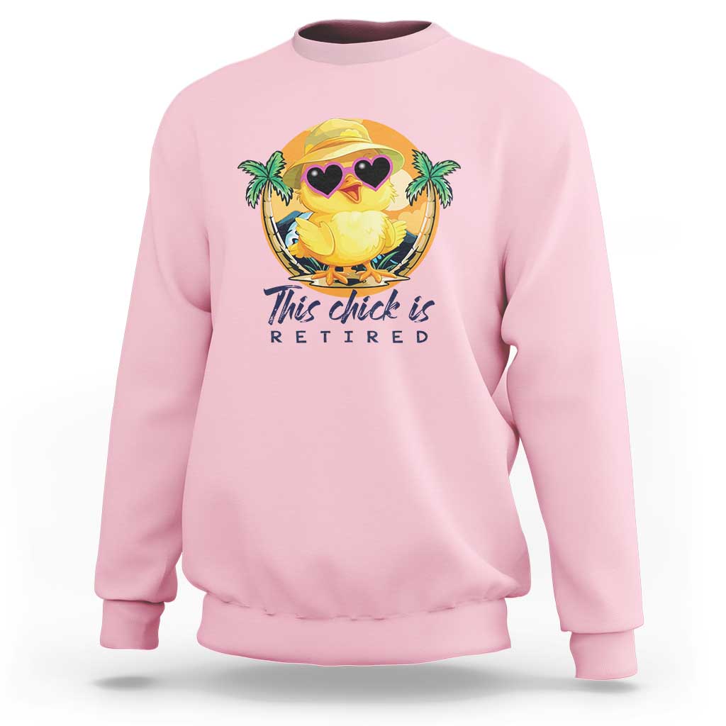 Light pink sweatshirt with cartoon chick graphic and 'This chick is retired' print.