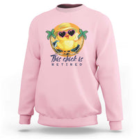 Light pink sweatshirt with cartoon chick graphic and 'This chick is retired' print.