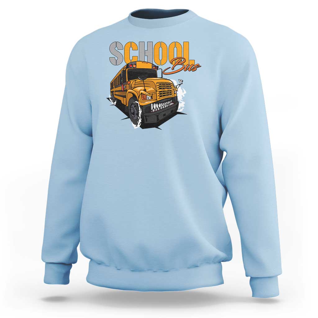 Light blue sweatshirt with school bus graphic, crewneck and long sleeves, front view.