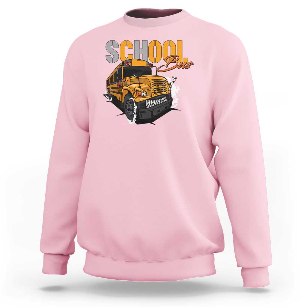 Light pink sweatshirt with school bus graphic, crewneck and long sleeves, front view.