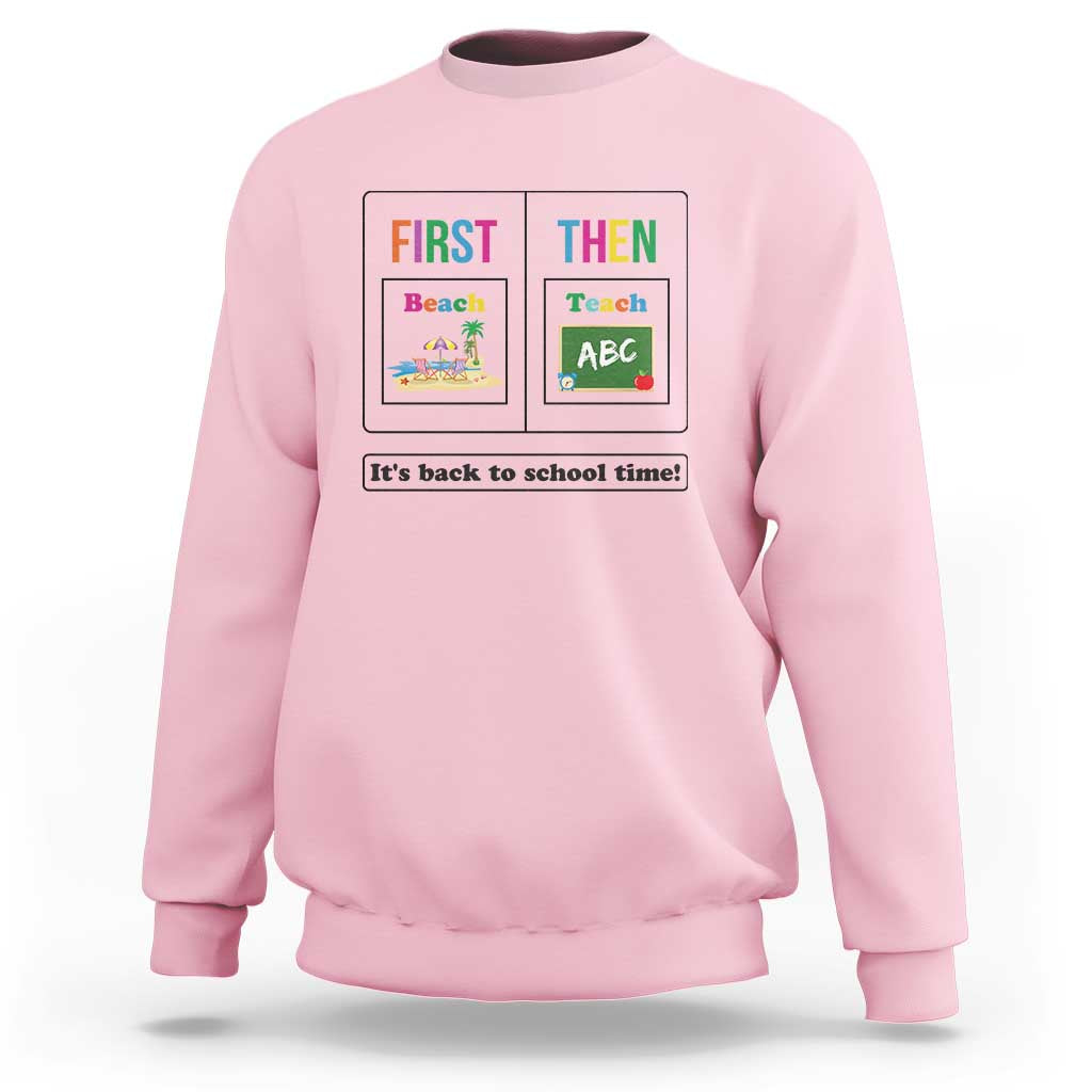 Light pink teacher sweatshirt with “First Then” back-to-school graphic on the front