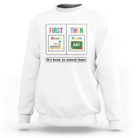 White teacher sweatshirt with “First Then” back-to-school graphic on the front