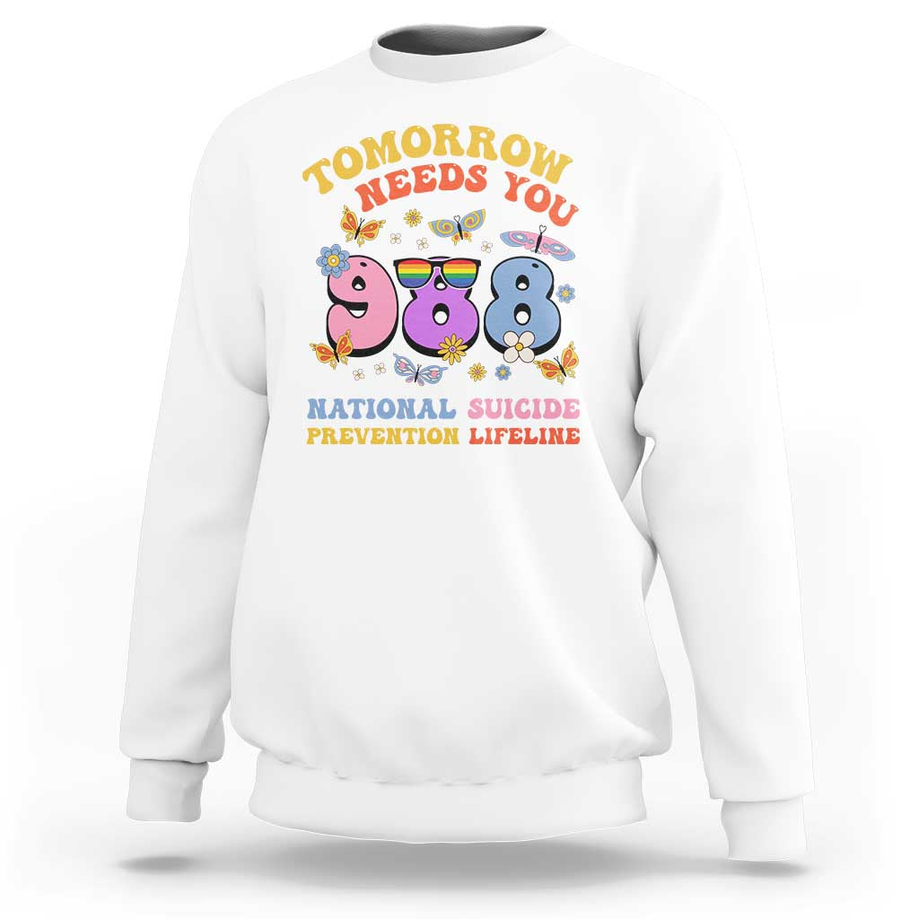 White crewneck sweatshirt with colorful “Tomorrow Needs You” suicide prevention graphic