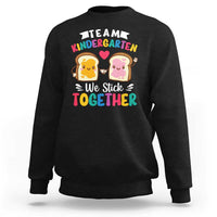 Black kids sweatshirt with back graphic 'We Stick Together' and 'Team Kindergarten'.