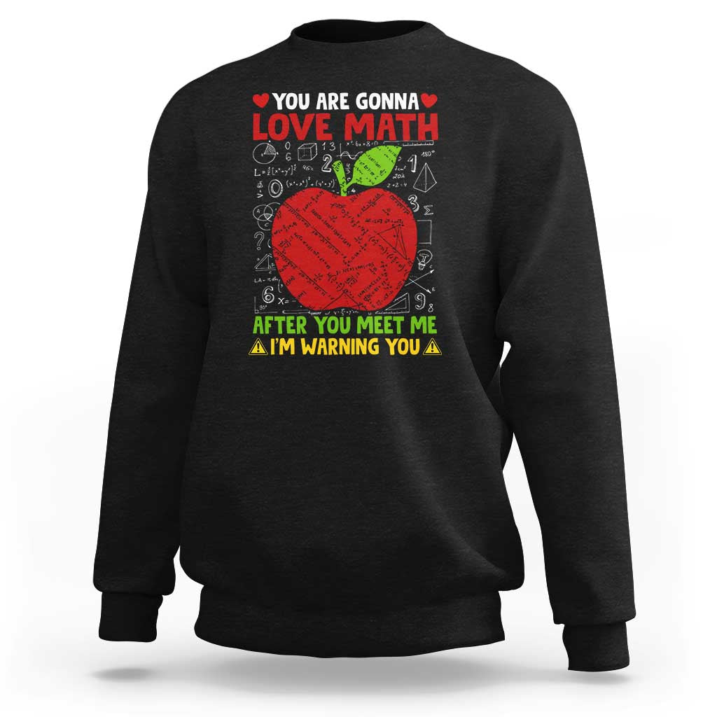 Black sweatshirt with math graphic: LOVE ME MATH and red apple.