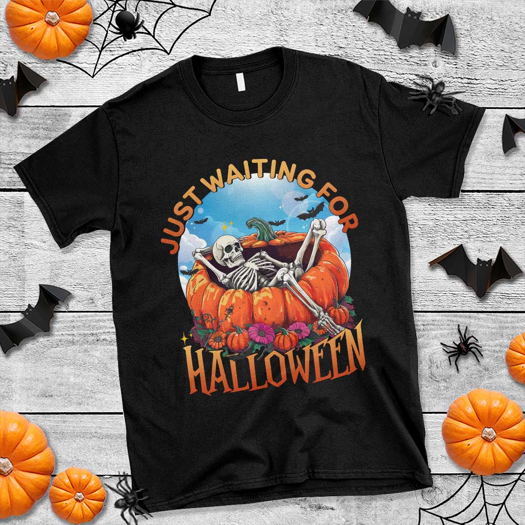 Black Halloween T-shirt with skeleton and pumpkin graphic, “Just Waiting For Halloween” text