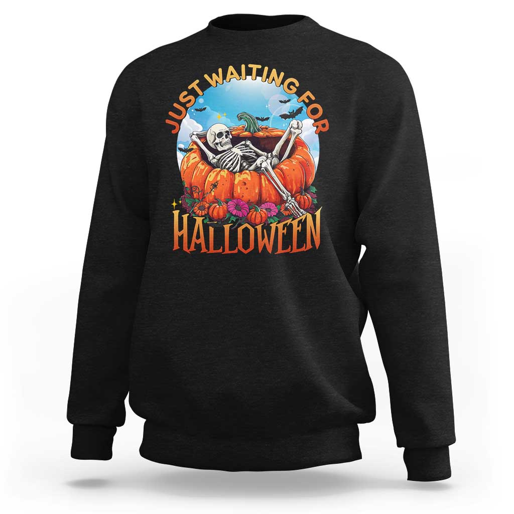 Black Halloween sweatshirt with skeleton, pumpkins, and “Halloween” front graphic
