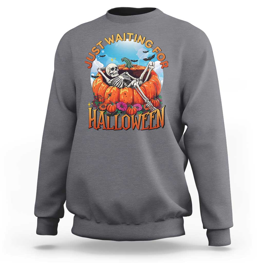 Light gray Halloween sweatshirt with skeleton, pumpkins, and “Halloween” front graphic