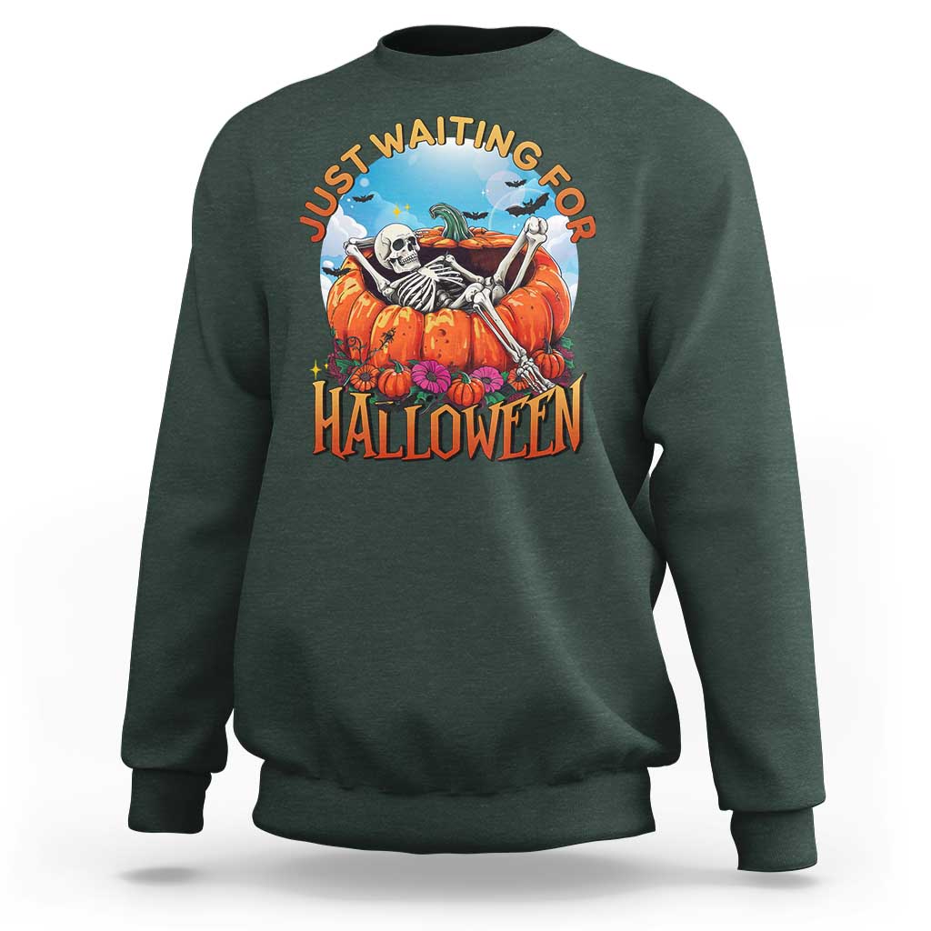 Dark green Halloween sweatshirt with skeleton, pumpkins, and “Halloween” front graphic