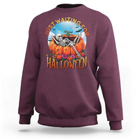 Maroon Halloween sweatshirt with skeleton, pumpkins, and “Halloween” front graphic
