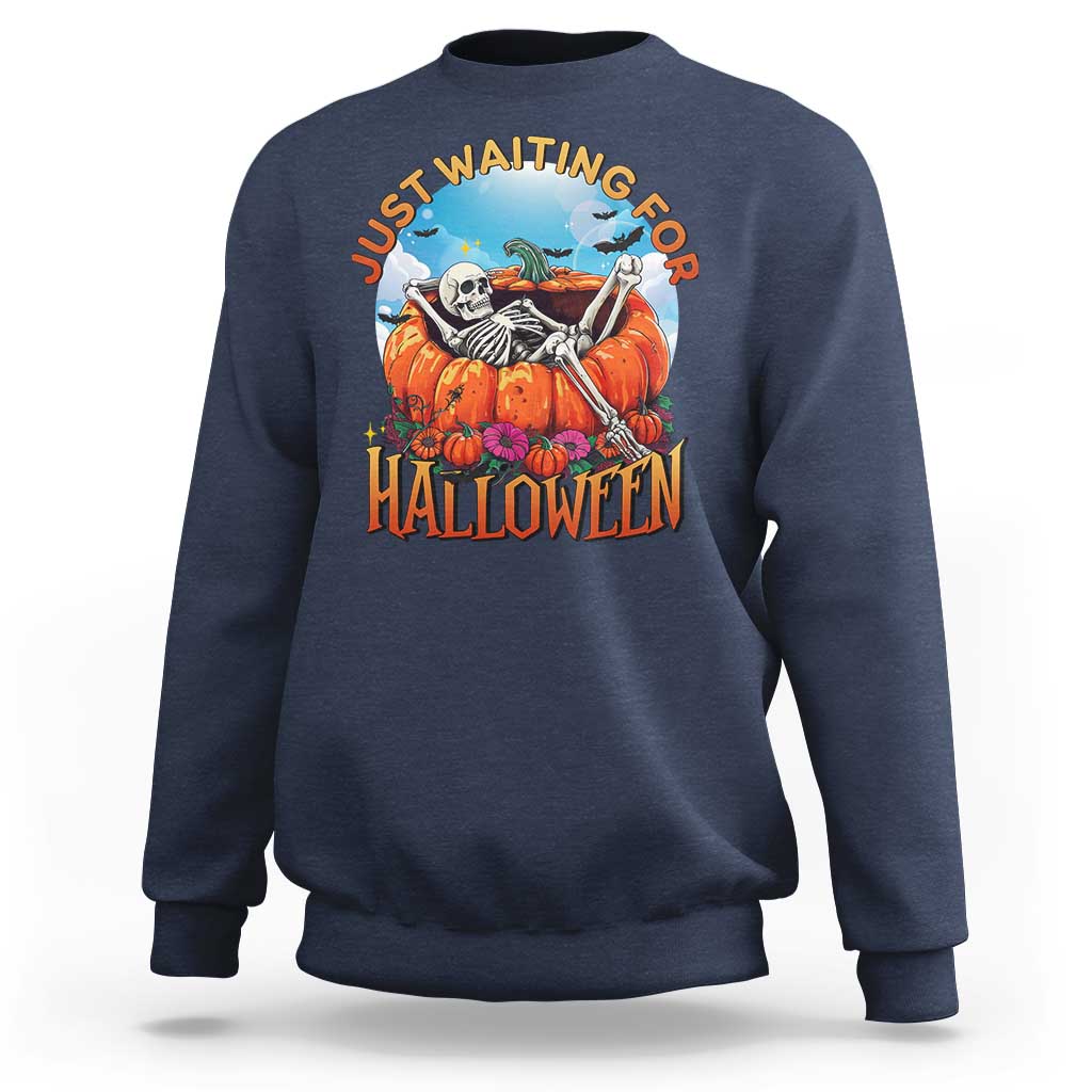 Dark blue Halloween sweatshirt with skeleton, pumpkins, and “Halloween” front graphic