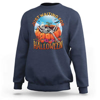 Dark blue Halloween sweatshirt with skeleton, pumpkins, and “Halloween” front graphic