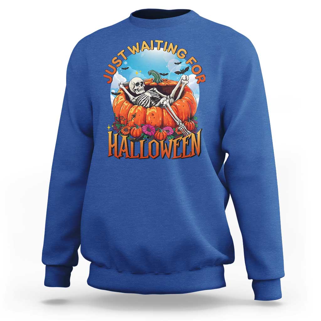 Royal blue Halloween sweatshirt with skeleton, pumpkins, and “Halloween” front graphic