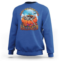 Royal blue Halloween sweatshirt with skeleton, pumpkins, and “Halloween” front graphic