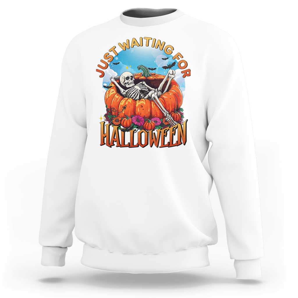 White Halloween sweatshirt with skeleton, pumpkins, and “Halloween” front graphic