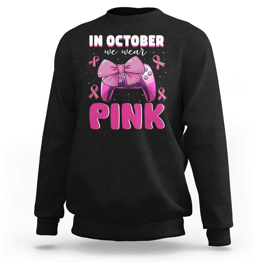 Black breast cancer awareness sweatshirt with 'In October we wear Pink' graphic