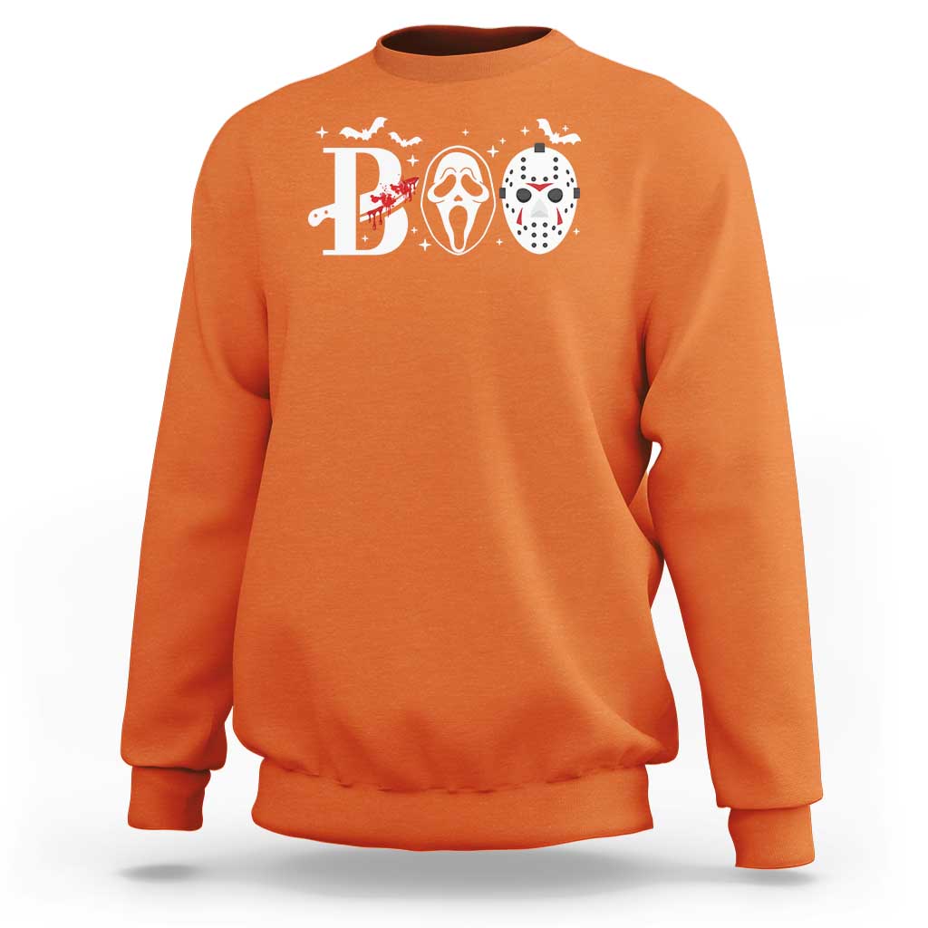 Orange Halloween sweatshirt with 'B' graphic and three horror masks