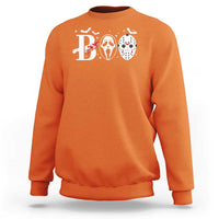Orange Halloween sweatshirt with 'B' graphic and three horror masks