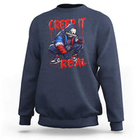 Navy Halloween horror sweatshirt with 'Creep It Real' graphic front