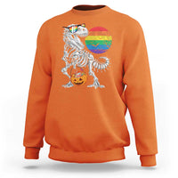 Orange Halloween sweatshirt with T-Rex skeleton, rainbow moon, and jack-o'-lantern graphic