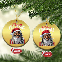 Gold circular Santa Christmas ornaments hanging on tree branches, “Merry Christmas”