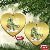 Two gold heart-shaped hanging ornaments with Tree Rex dinosaur and star charm