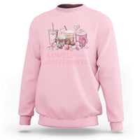 Light pink crewneck sweatshirt with pink coffee and hearts graphic on chest