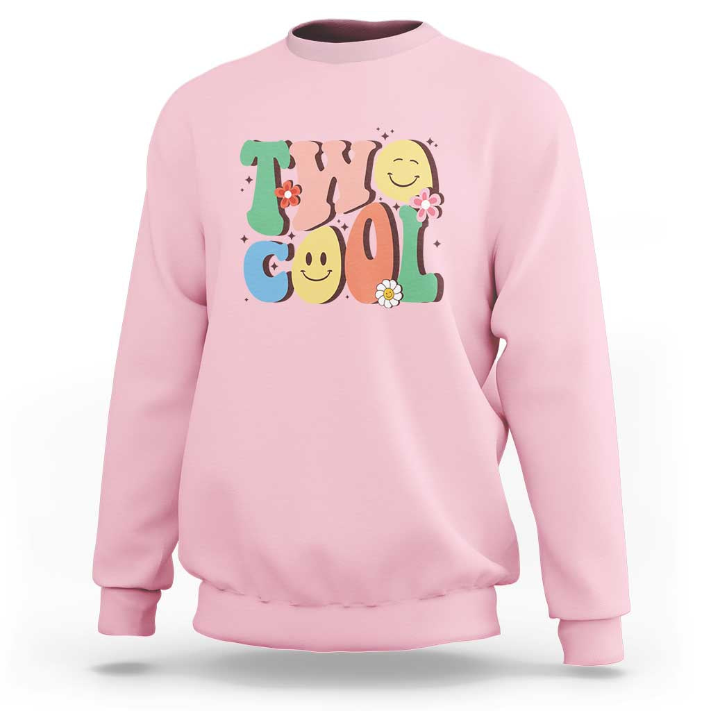 Light pink sweatshirt with colorful “2” birthday graphic, flowers, and smiling face