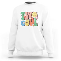 White sweatshirt with colorful “2” birthday graphic, flowers, and smiling face