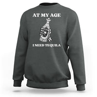 Charcoal sweatshirt with 'AT MY AGE I NEED TEQUILA' white print and bottle icon