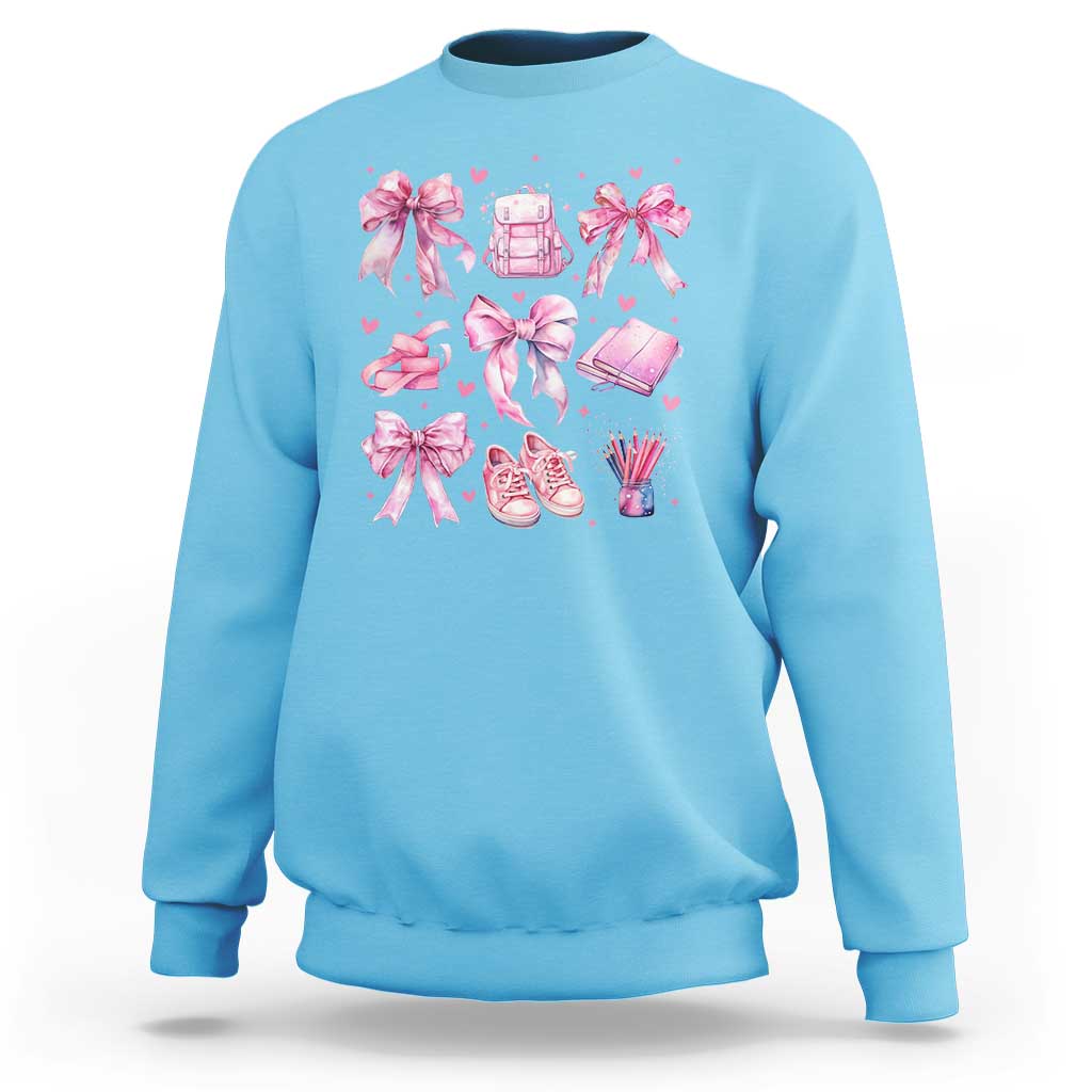 Sky blue school sweatshirt with pink bow-heart backpack and pencils graphic