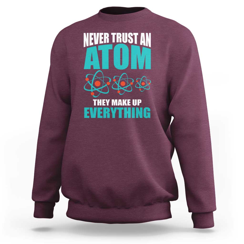 Maroon science sweatshirt with atomic graphic and back text