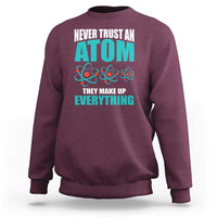 Maroon science sweatshirt with atomic graphic and back text
