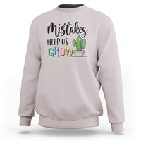 White crewneck sweatshirt with front 'Help Us Grow' cactus graphic.