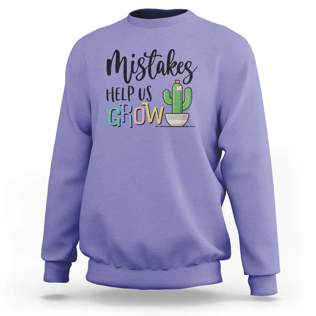 Purple crewneck sweatshirt with front 'Help Us Grow' cactus graphic.