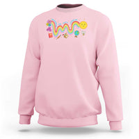 Light pink sweatshirt with front rainbow wavy graphic and flower chick design