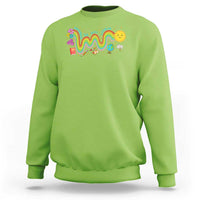 Green sweatshirt with front rainbow wavy graphic and flower chick design