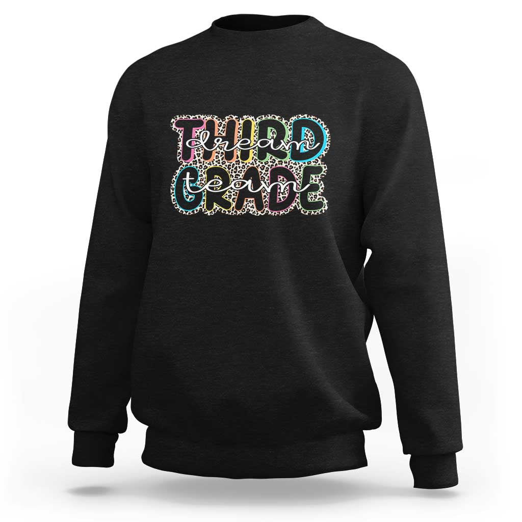 Black sweatshirt with "Dream Team Grade" graphic on chest