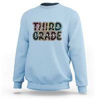 Light blue sweatshirt with "Dream Team Grade" graphic on chest