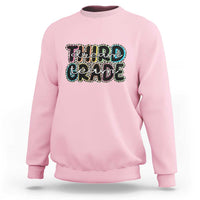 Pink sweatshirt with "Dream Team Grade" graphic on chest