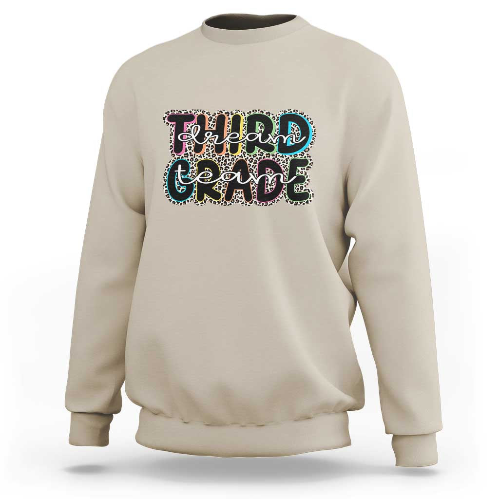 Sand sweatshirt with "Dream Team Grade" graphic on chest