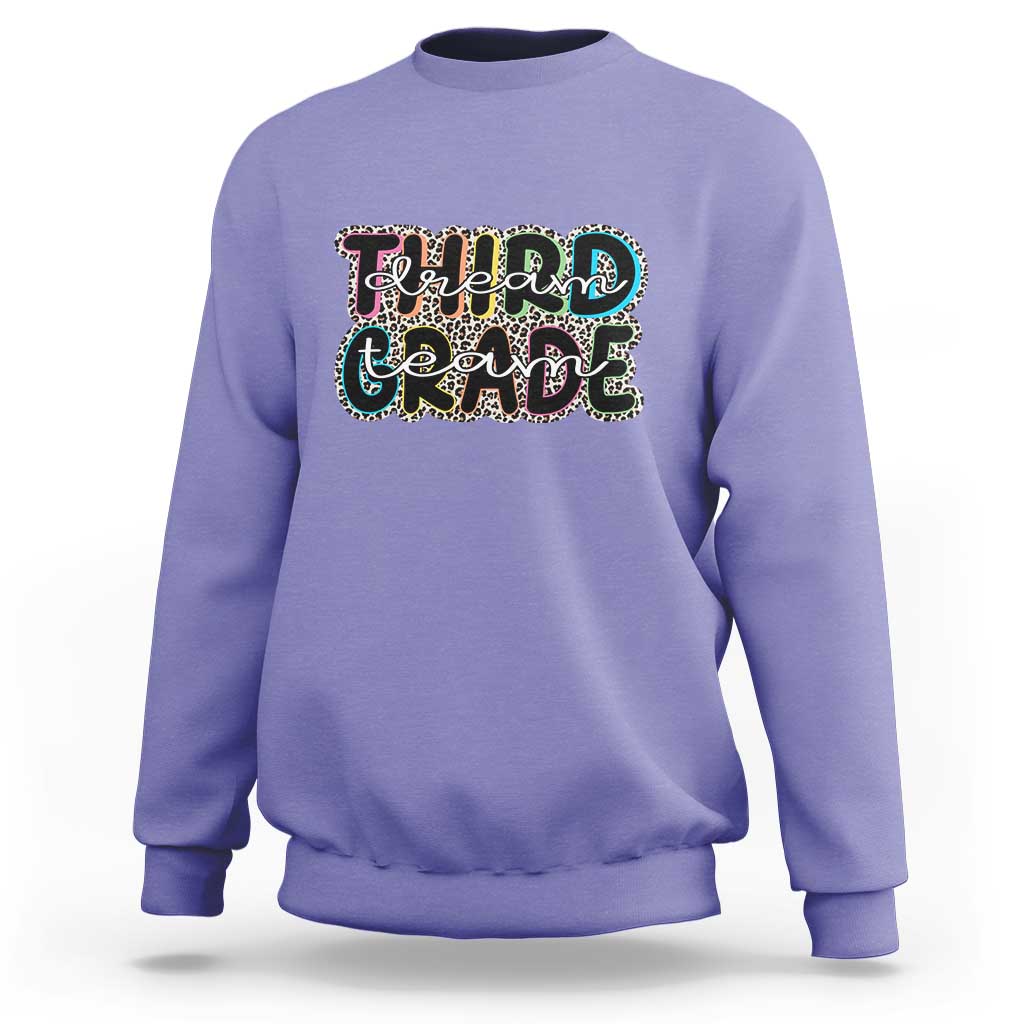 Violet sweatshirt with "Dream Team Grade" graphic on chest