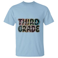 Light blue crew-neck T-shirt with colorful “Dream Team Grade 3” graphic on the front