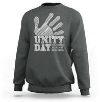 Dark heather Unity Day anti-bullying sweatshirt, back view with hand and slogan graphic