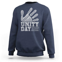 Navy Unity Day anti-bullying sweatshirt, back view with hand and slogan graphic